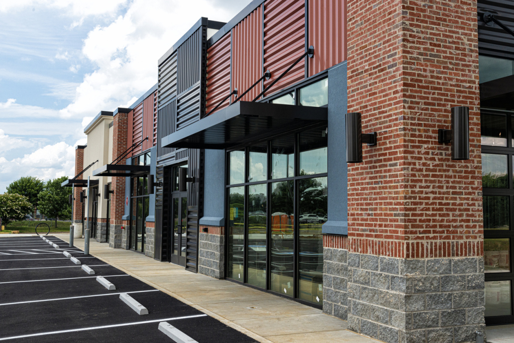 Modern commercial building with brick facade and glass windows