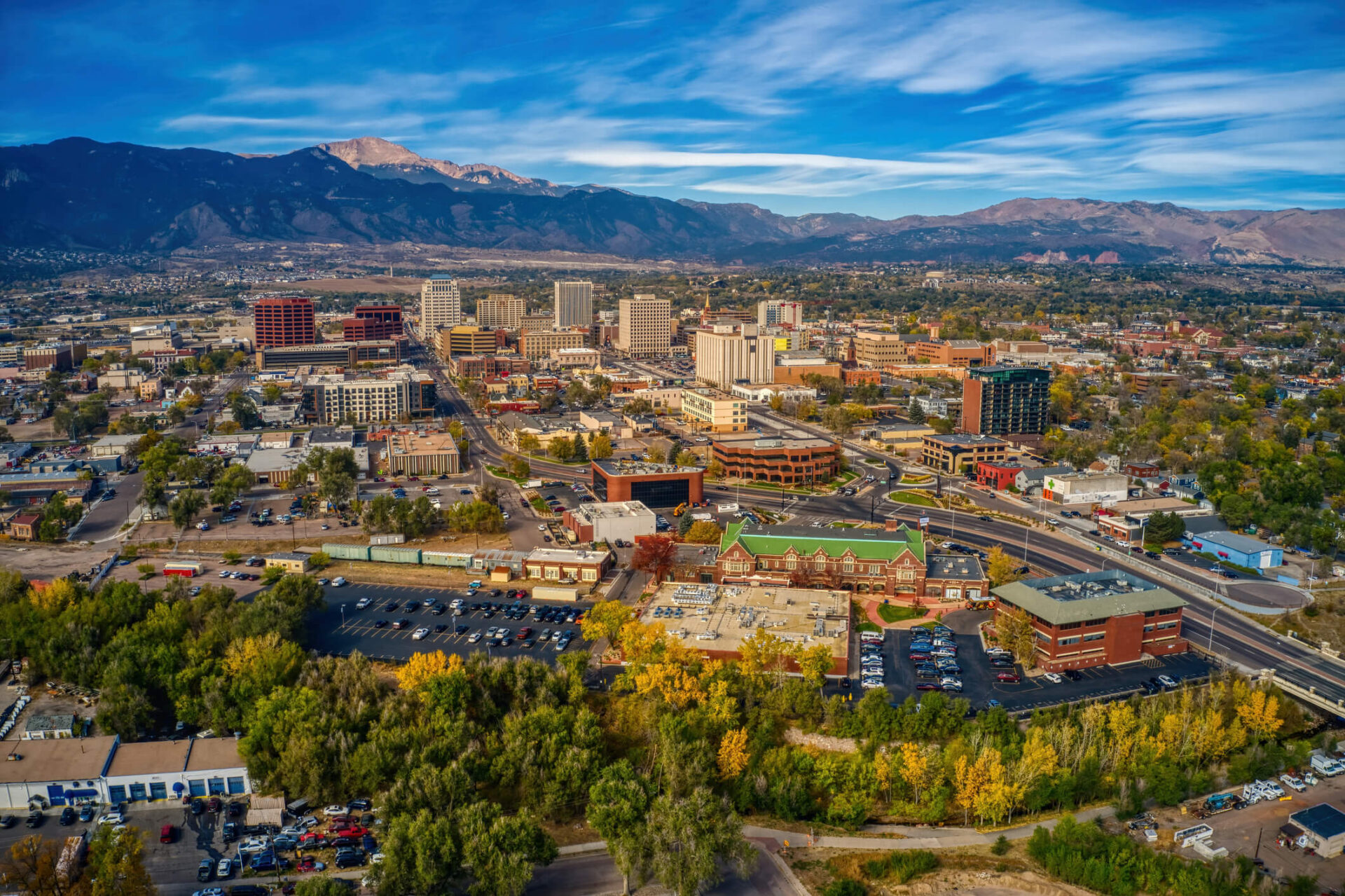 Aerial view of Colorado Springs with Pikes Peak in the background.
