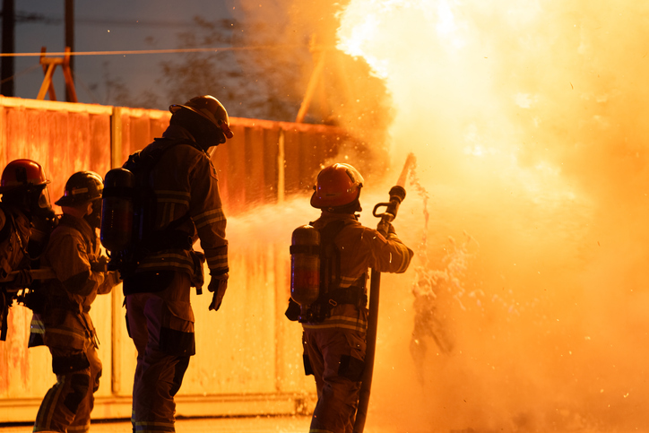Firefighters battling a large blaze at a fire training exercise.