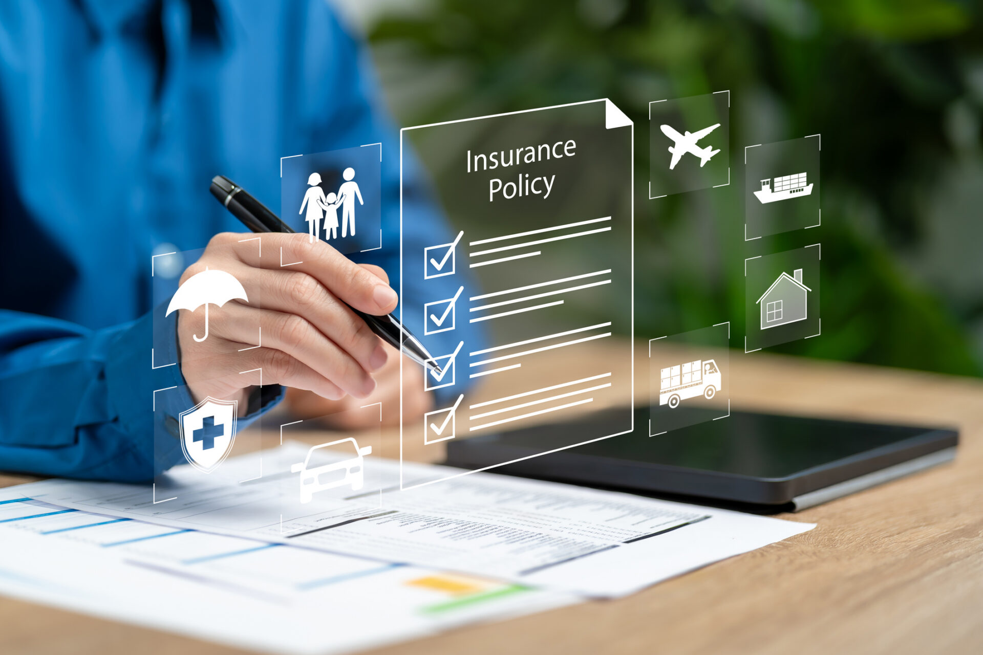 Hand filling insurance policy checklist with icons