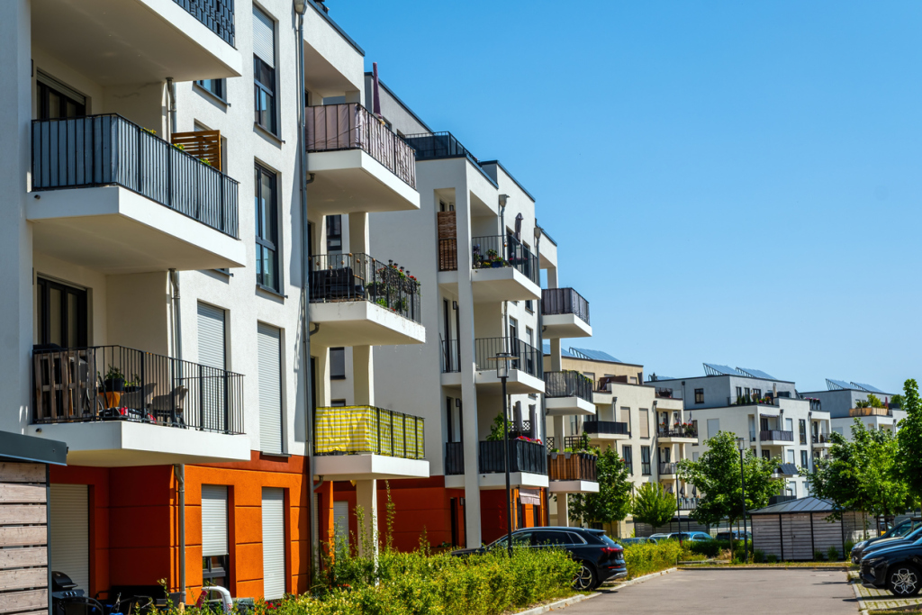 Modern apartment buildings with balconies in a sunny urban neighborhood