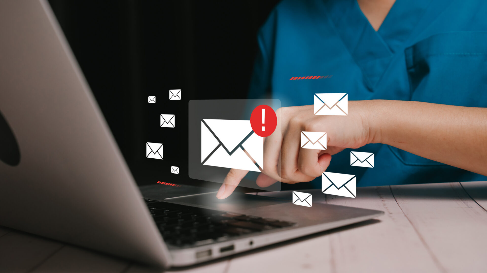 Person checking email notifications on a laptop screen.