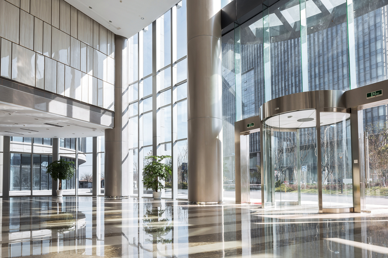 Modern building lobby with large glass doors and natural light