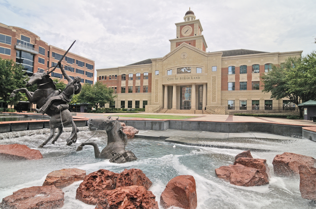 City of Sugar Land building with fountain and sculptures